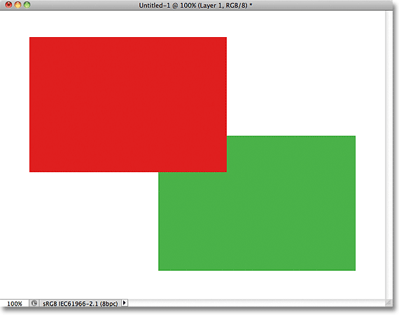 The red shape now appears in front of the green shape. Image © 2011 Photoshop Essentials.com