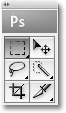 The 'PS' icon at the top of Photoshop's Tools palette appearing in gray. Image © 2009 Photoshop Essentials.com