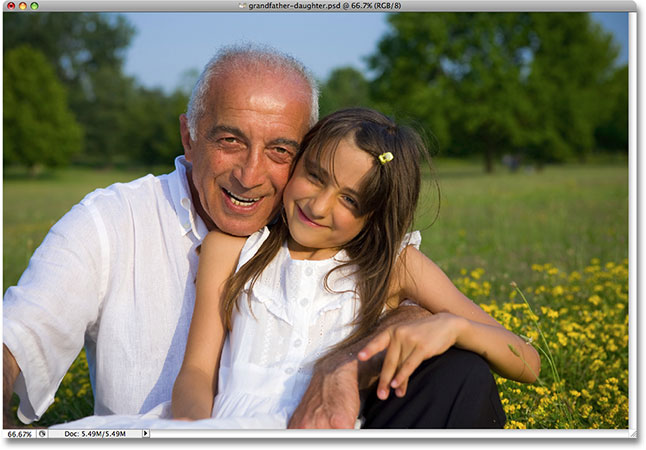 A photo of a grandfather with his grand daughter. Image licensed by Photoshop Essentials.com from iStockphoto.