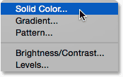 Selecting a Solid Color fill layer. Image © 2014 Photoshop Essentials.com.