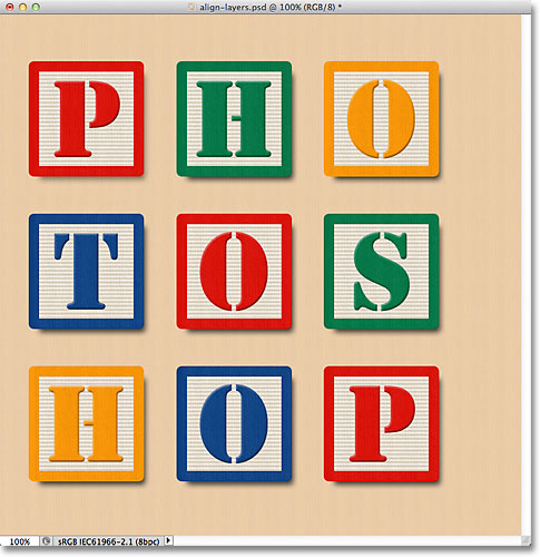 The blocks are now aligned vertically with the Background layer. Image © 2011 Photoshop Essentials.com