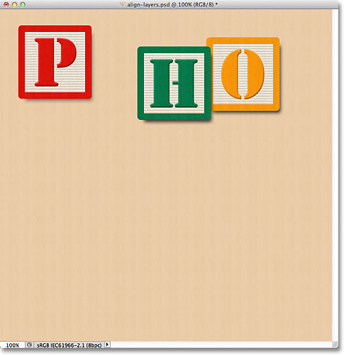 The blocks on the selected layers remain visible. Image © 2011 Photoshop Essentials.com