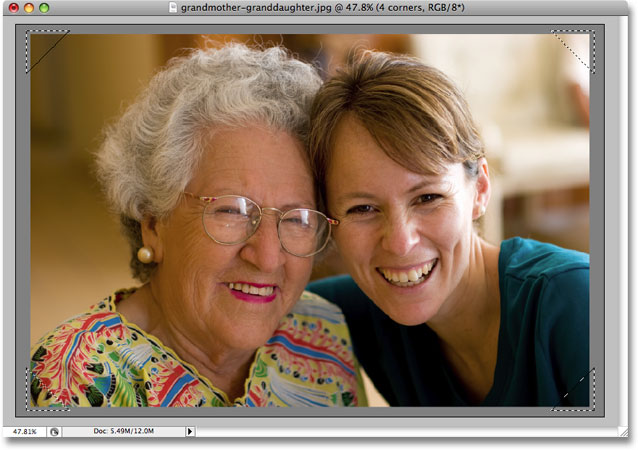 A triangular selection now appears in each corner of the image. Image copyright © 2008 Photoshop Essentials.com