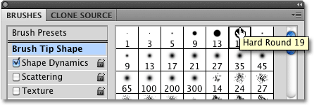 Choosing the Hard Round 19 pixel brush from the Brushes panel in Photoshop. Image © 2010 Photoshop Essentials.com