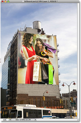 The photo of two women shopping now appears on the billboard. Image © 2009 Photoshop Essentials.com