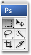 The 'PS' icon at the top of Photoshop's Tools palette appearing in blue. Image © 2009 Photoshop Essentials.com