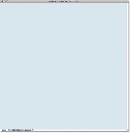 The document is now filled with light blue. Image © 2011 Photoshop Essentials.com