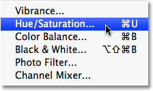 Selecting the Hue/Saturation image adjustment in Photoshop. Image © 2009 Photoshop Essentials.com