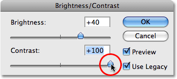 Dragging the Contrast slider all the way to the right. Image © 2009 Photoshop Essentials.com