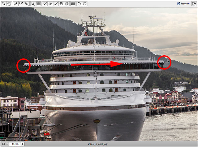 Clicking and dragging with the Straighten Tool. Image © 2013 Steve Patterson, Photoshop Essentials.com