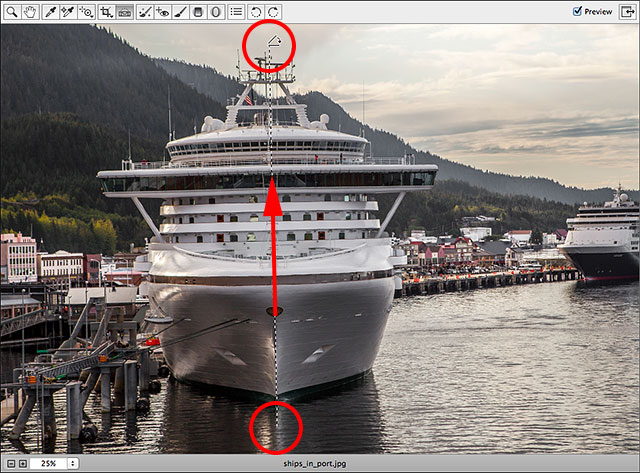 Dragging across an area that should be vertically straight with the Straighten Tool. Image © 2013 Steve Patterson, Photoshop Essentials.com