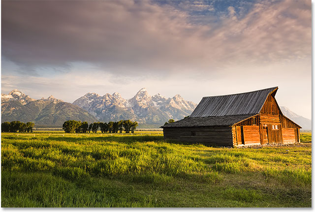 Iconic T. A. Moulton barn and Teton peaks at dawn in Grand Teton National Park, WY. Image licensed from Shutterstock by Photoshop Essentials.com