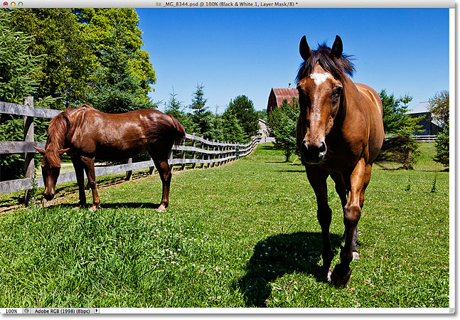 The blue sky now appears darker after dragging the Blues slider. Image © 2012 Photoshop Essentials.com