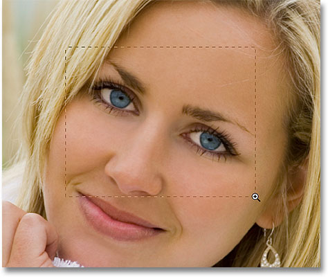 Drawing a selecting around the eyes with the Zoom Tool in Photoshop. Image © 2010 Photoshop Essentials.com