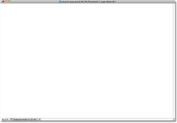 The image is now completely white in the document window. Image © 2010 Photoshop Essentials.com