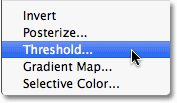 Selecting a Threshold adjustment layer in Photoshop. Image © 2010 Photoshop Essentials.com