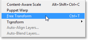 Selecting the Free Transform command from the Edit menu. Image © 2013 Photoshop Essentials.com