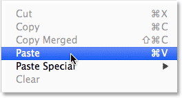Choosing the Paste command from the Edit menu in Photoshop. Image © 2014 Photoshop Essentials.com