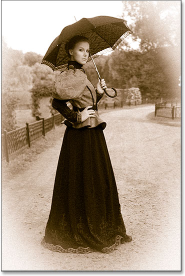 The antique photo effect after adding both the grain and the vignette. Image © 2014 Photoshop Essentials.com