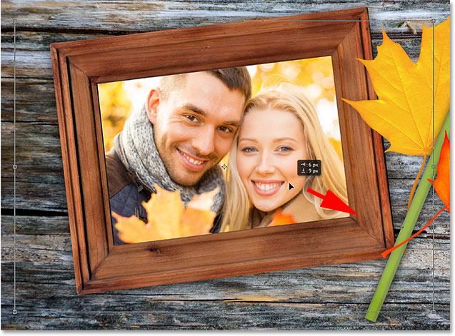 Repositioning the image inside the frame with Free Transform. Image © 2014 Photoshop Essentials.com.
