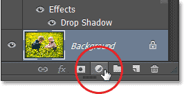 Clicking the New Adjustment Layer icon in the Layers panel. Image © 2013 Photoshop Essentials.com