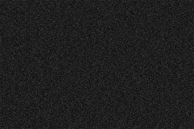 The noise is now larger after scaling the layer. Image © 2013 Photoshop Essentials.com