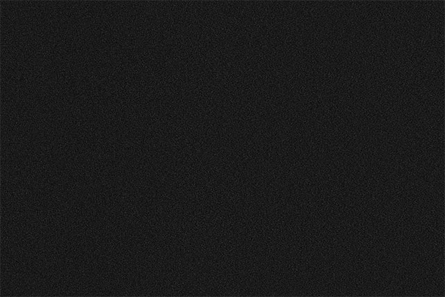 The image after filling the Snow layer with noise. Image © 2013 Photoshop Essentials.com