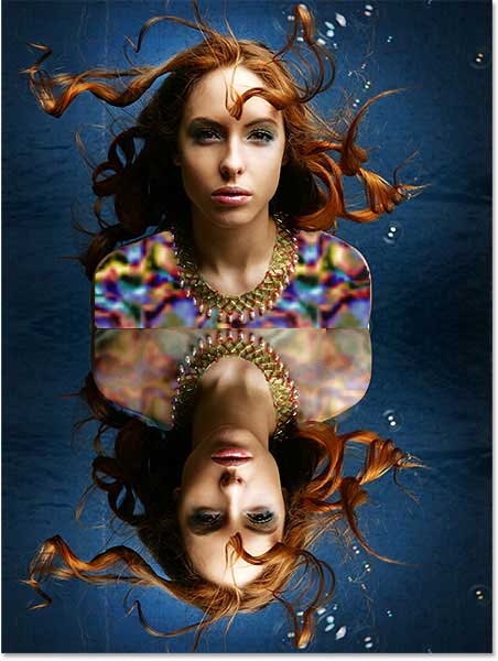 The document after flipping the copy of the image vertically. Image © 2013 Photoshop Essentials.com