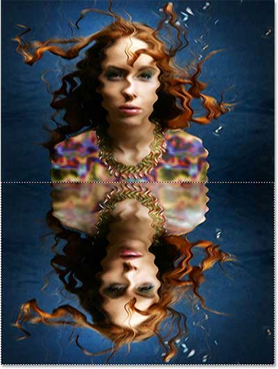 A selection outline is loaded around the bottom half of the image. Image © 2013 Photoshop Essentials.com