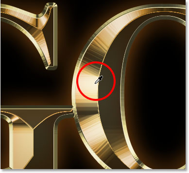 Sampling a gold color from the text with the Eyedropper Tool. 
