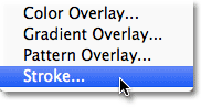 Choosing a Stroke layer effect from the Layers panel.